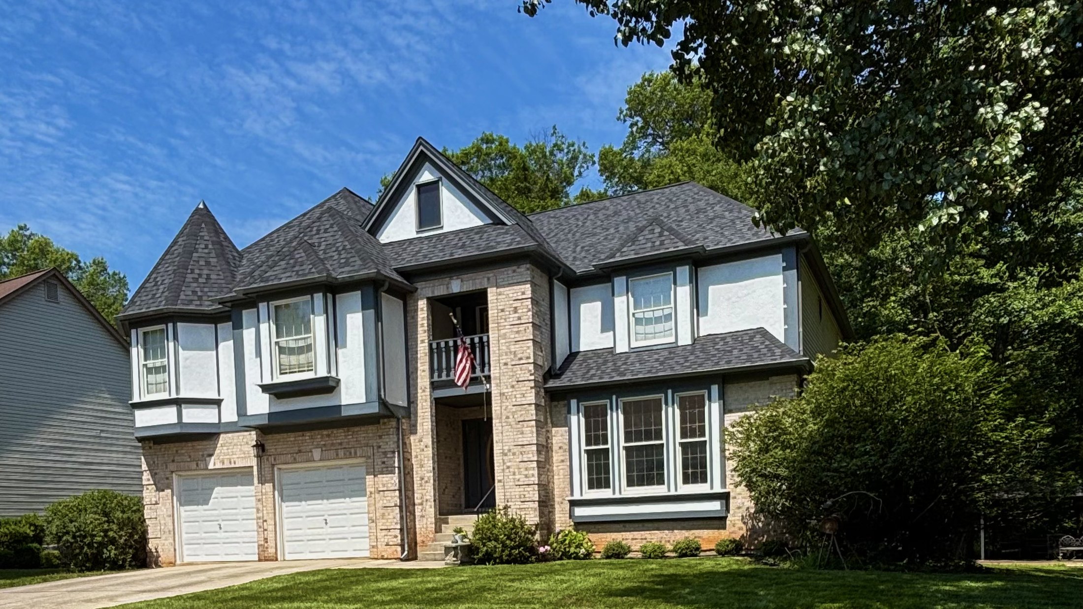 Front home with freshly maintained lawn and curb appeal